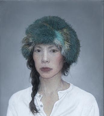 The subject of the portrait wears a white collarless shirt, and has a green fur hat on her head. Her dark hair is in a plait which is over one shoulder, with loose tendrils. She looks directly at the viewer.