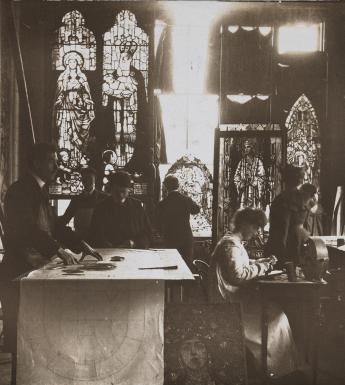 Vintage black and white photo of a stained glass studio