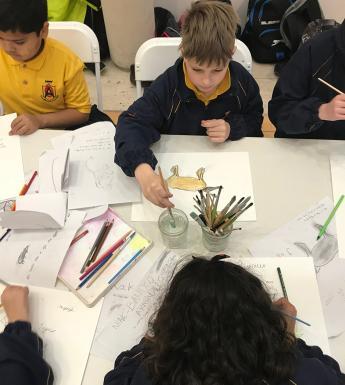 School kids drawing at a workshop in the Gallery