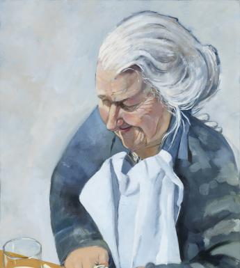 A woman stands over a counter, slicing and peeling apples and placing them in a pot in front of her. She has upswept grey hair, and is frowning in concentration.