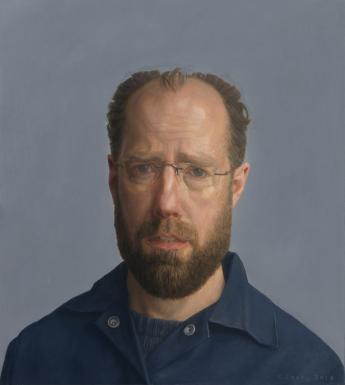 The sitter looks directly at the viewer. We see his head and shoulders. He wears an open neck dark blue shirt over a dark blue t-shirt. The background is a slightly lighter shade of blue-grey.