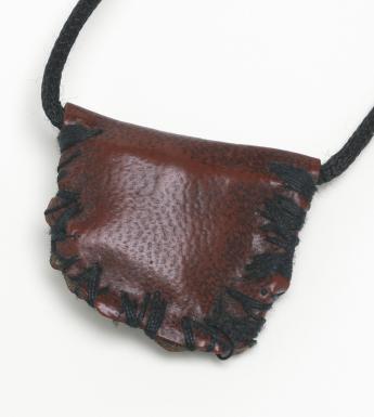A red leather pouch hanging from a leather string