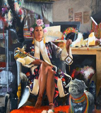 Portrait of woman seated in her studio surrounded by objects and materials