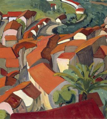 A view from above of red and orange rooftops in a green landscape
