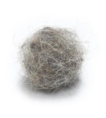 A spherical sculpture made from the artist’s hair, dust & detritus
