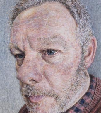 Detailed close-up painted portrait a man's face with grey hair and short beard and wearing a red jumper and checked shirt