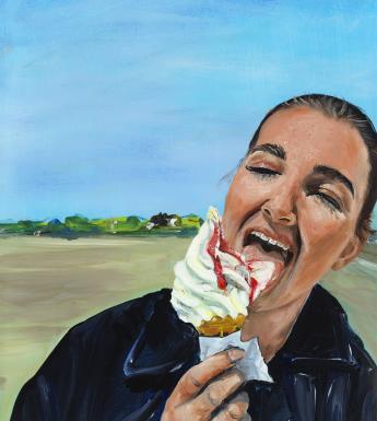A young woman eats a 99 icecream with gusto, her eyes closed. Behind her, blue skies and a beach.