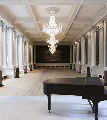 View of the Shaw Room at the National Gallery of Ireland, with a piano in the foreground.