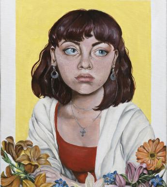 Portrait of a young girl wearing a white cardigan, on a yellow background, with orange and white lilies and coloured flowers in the foreground