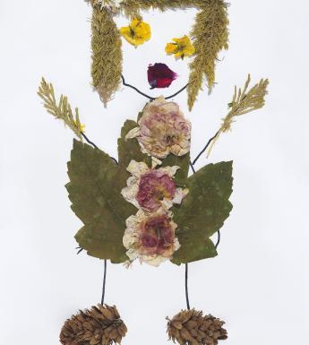 Collage of a girl made of leaves, flowers and branches