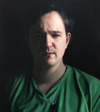 Painting of a male figure with dark hair wearing green medical scrubs on a black background