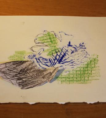 A mixed media print in blue, green and brown on a sheet of white paper.