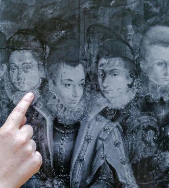 Hand point out pentimenti in a technical image of Fontana's painting 