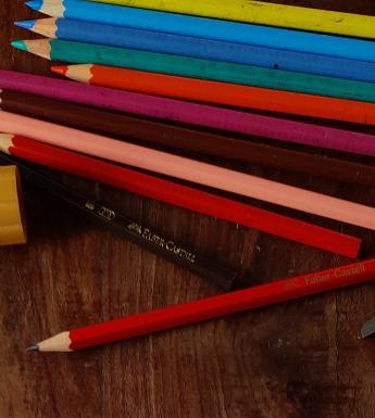 Colouring pencils, a scissors and a glue stick