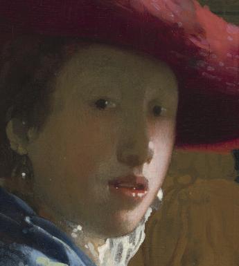 A woman in blue wearing a wide brimmed red hat looks over her shoulder, directly at the viewer. She is wearing pearl earrings, and the background has an intricate green and white pattern.