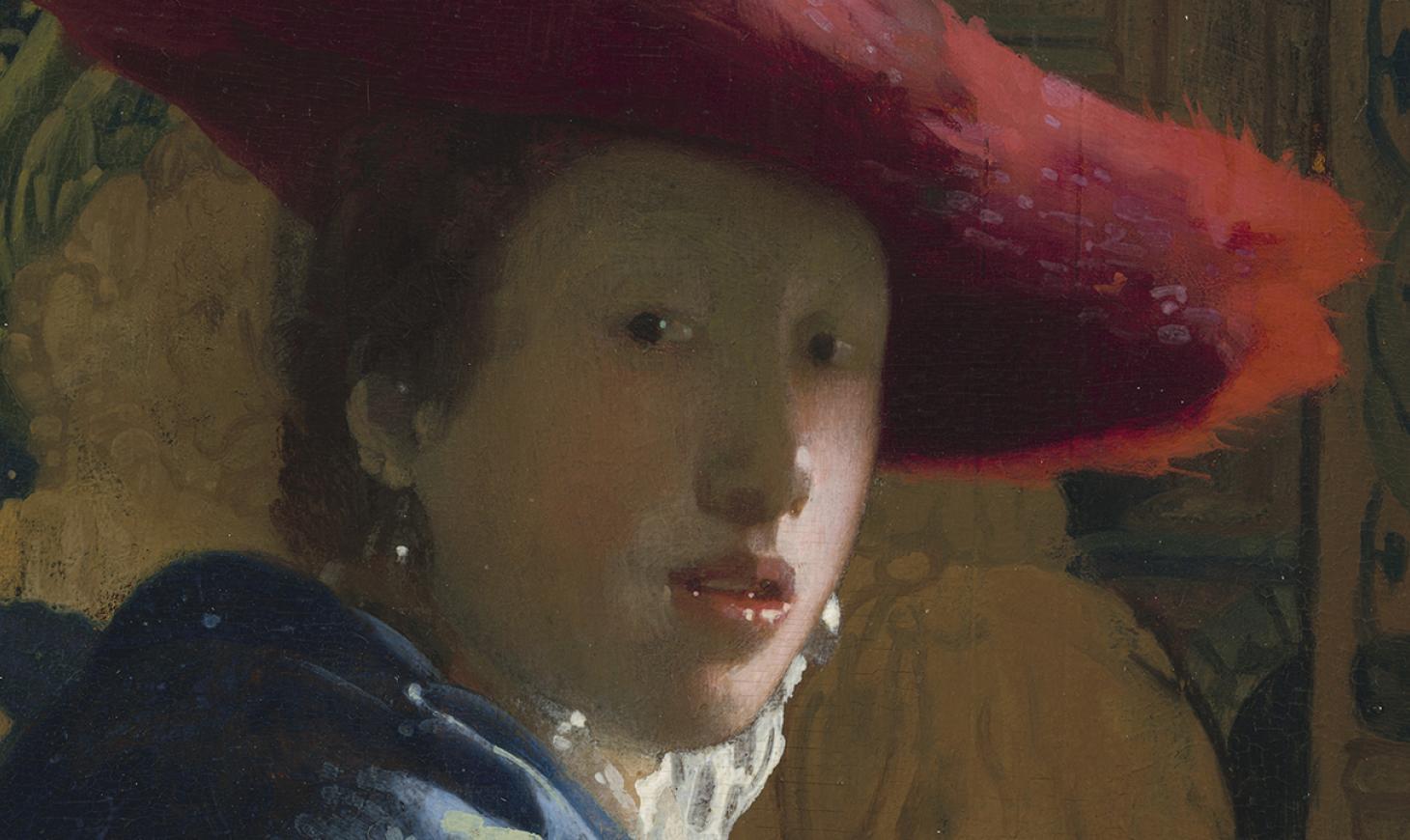 A woman in blue wearing a wide brimmed red hat looks over her shoulder, directly at the viewer. She is wearing pearl earrings, and the background has an intricate green and white pattern.