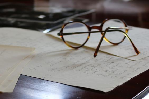 Photo of Denis Mahon's reading glasses on a desk