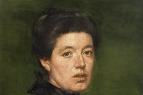 Naturalistic half-length portrait of a pale woman with her dark hair pinned up and wearing a high-necked black blouse with floral detailing at the throat