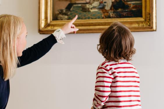 A child on a free tour of the permanent collection in the Millennium Wing in front of 'Women in an Eastern Courtyard'. © National Gallery of Ireland