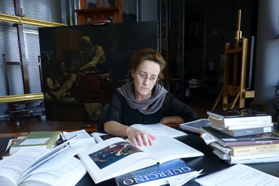 In preparation for conserving Jacob Blessing the Sons of Joseph, the Getty’s associate conservator Devi Ormond researches the history of the painting. Photo © Getty