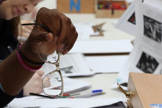 School students working on a project at a desk