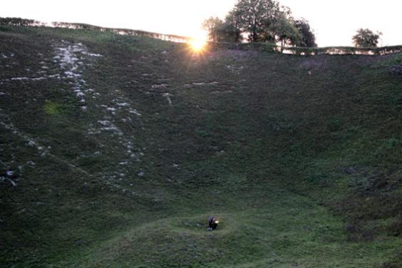 Artist Garrett Phelan recording sound in the field where the Battle of the Somme took place.