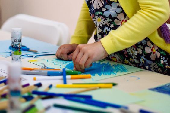 A child drawing during a drop-in family workshop at the Gallery.