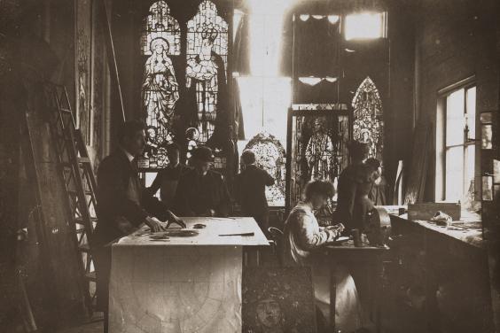 Vintage black and white photo of a stained glass studio