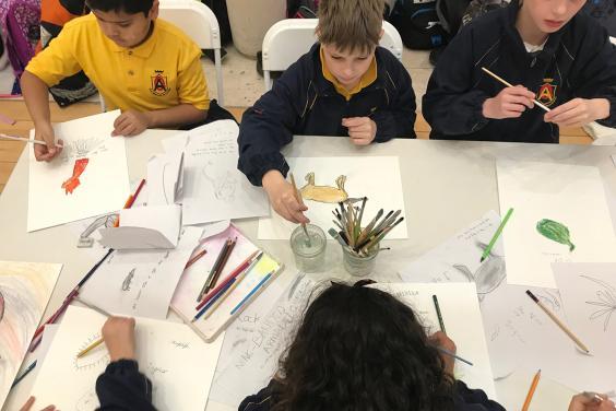 School kids drawing at a workshop in the Gallery