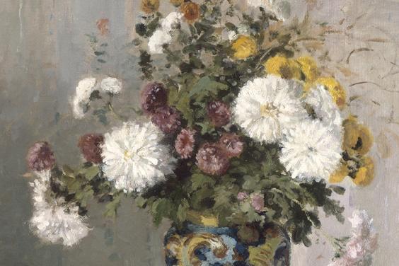 Detail of white, pink and yellow chrysanthemums in a blue and yellow patterned vase