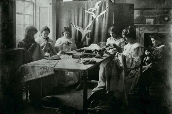 Vintage black and white photo of women sewing