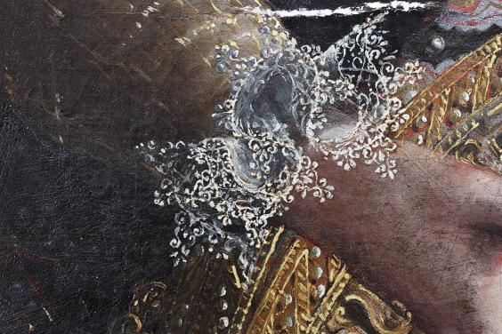 Detail of an intricate lace cuff in an oil painting