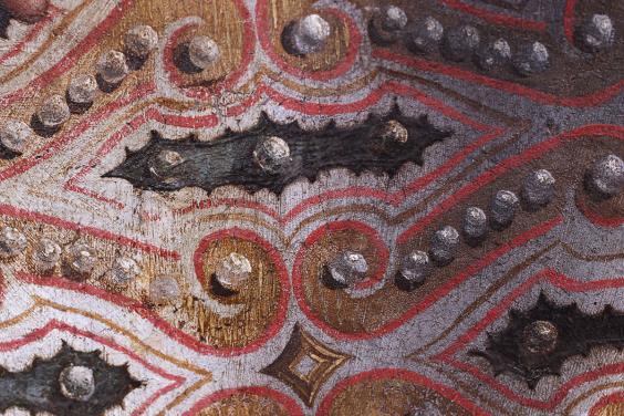 Detail of oil painting showing patterned textile embroidered with pearls