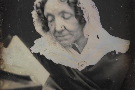 Daguerreotype portrait of a woman reading