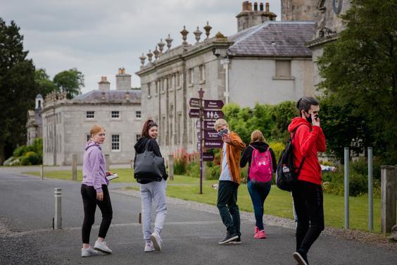 Group of young people walking towards Russborough House