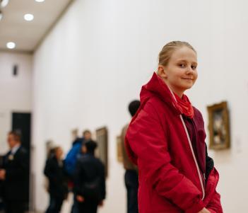 A young girl in an art gallery