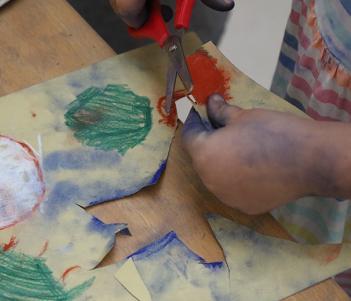Close-up of a child's hand as they create art at a drop-in family workshop  in the National Gallery of Ireland.