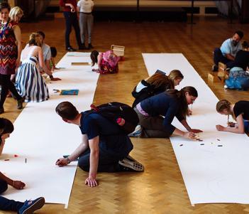 People taking part in a drawing activity in the National Gallery of Ireland.