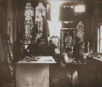 Vintage black and white photo of a stained glass studio