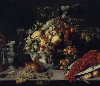 A view of a banquet table. Among the food shown (lobster, fruit, vegetables) we see a squirrel on the table, and to the right, a small monkey.