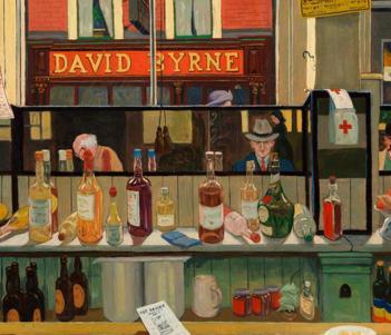 View of bottles and objects behind a bar with customers reflected in a mirror and a shop sign reading David Byrne visible through the window
