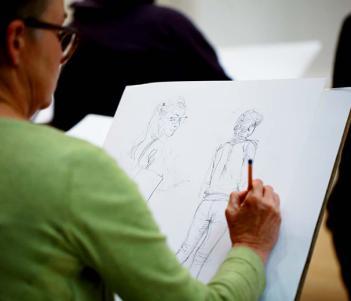 Woman drawing in the Gallery.