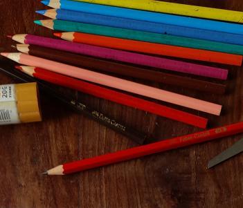 Colouring pencils, a scissors and a glue stick