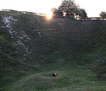 Artist Garrett Phelan recording sound in the field where the Battle of the Somme took place.