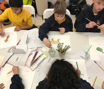 School kids drawing at a workshop in the Gallery