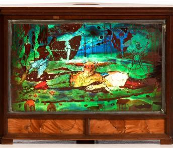 Stained glass panel of two figures reclining on green fields, surrounded by fairies.