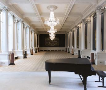 View of the Shaw Room at the National Gallery of Ireland, with a piano in the foreground.