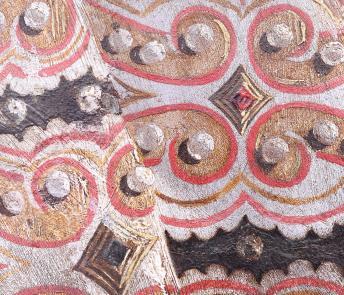 Detail of the intricate pattern of the Queens’ gown